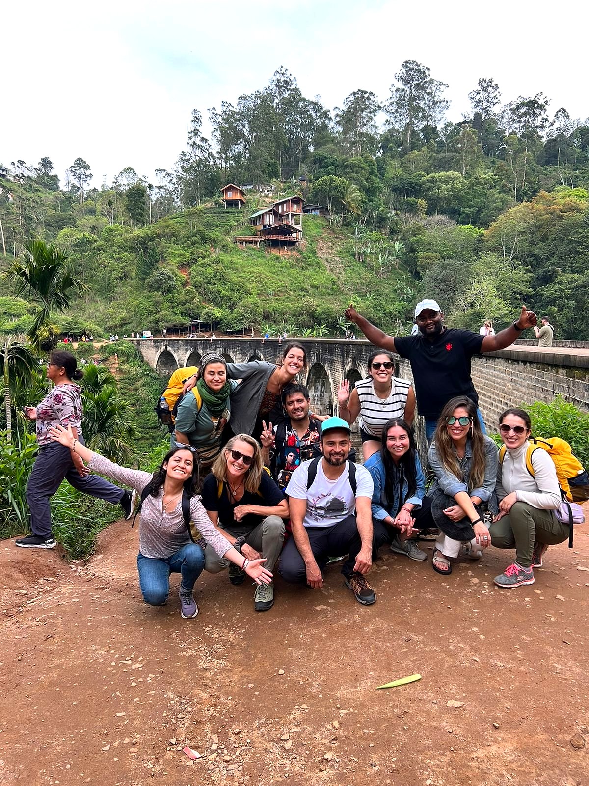 A happy group of Volata Travels guests at the Nine Arch Bridge in Ella