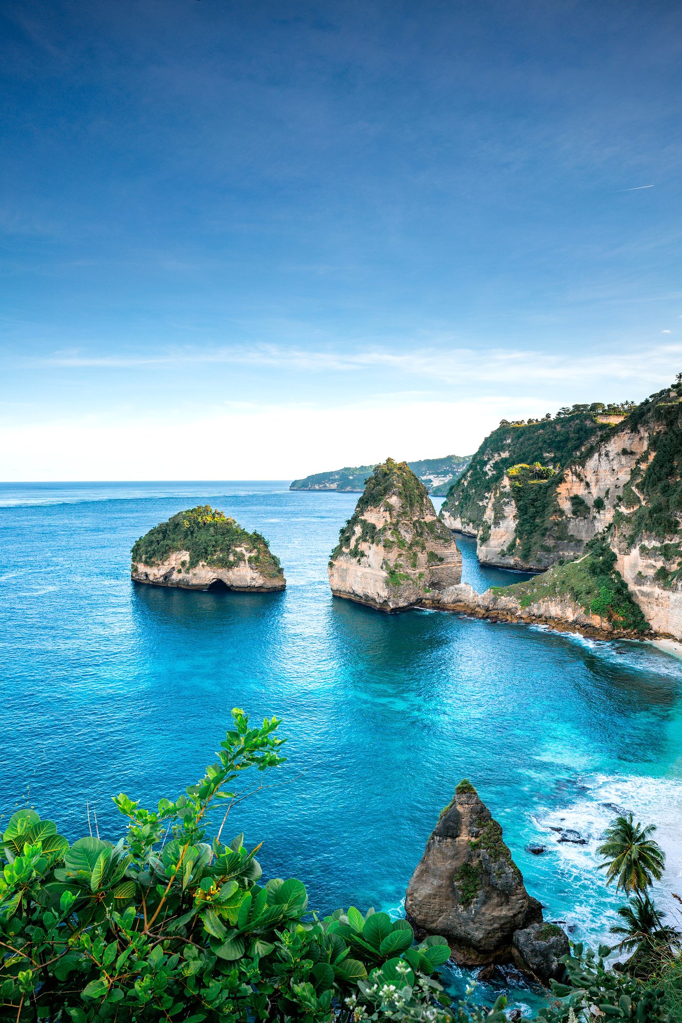 Dramatic sea cliffs and turquoise water on the Bali Island Escape tour