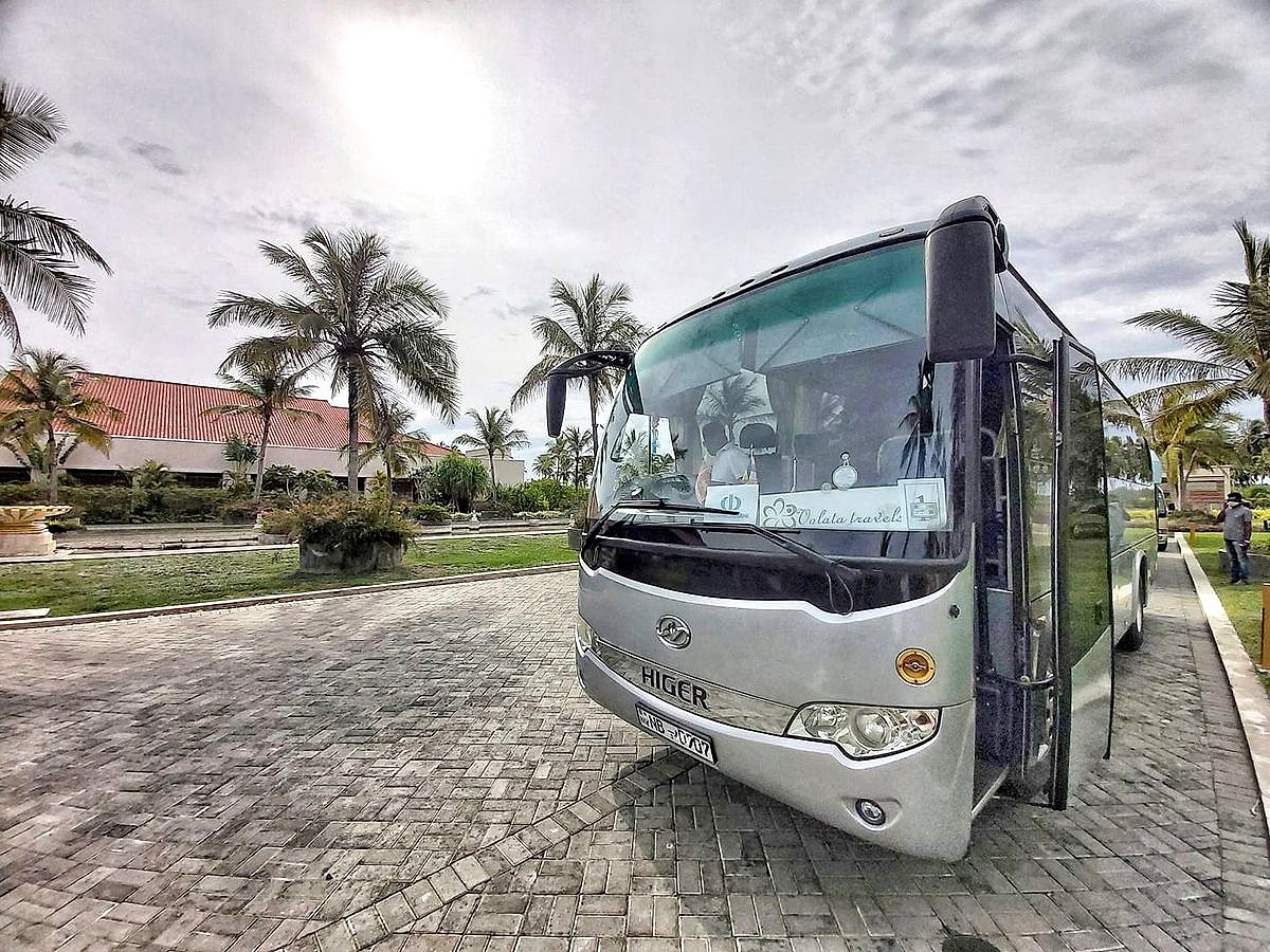 A Volata Travels minibus arriving at a hotel