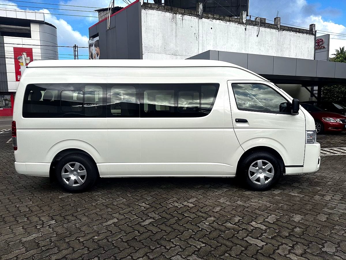 Volata Travels Toyota van on a hotel pickup